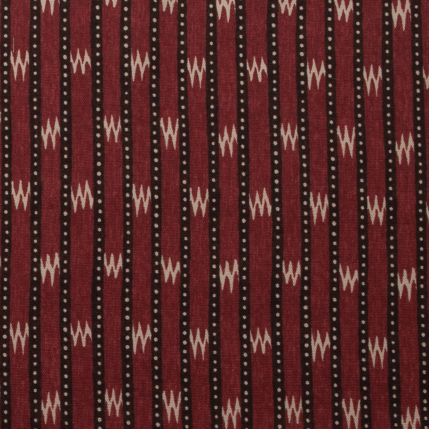 Vertical chocolate-red stripes with cream zigzags and dotted accents on cotton