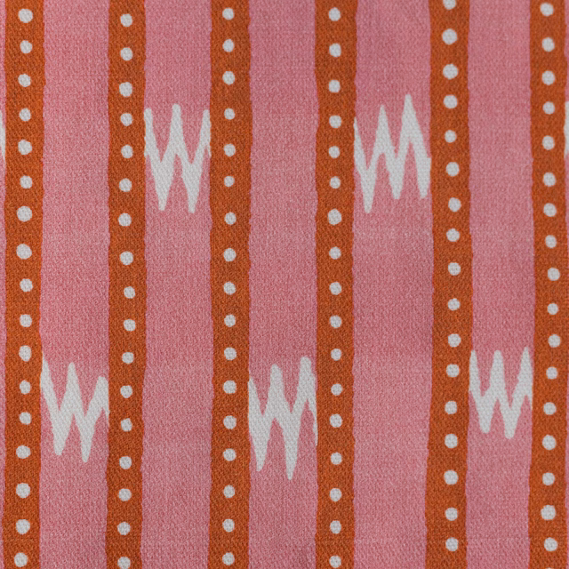 Coral pink printed cotton with orange dotted stripes and white zigzag motifs