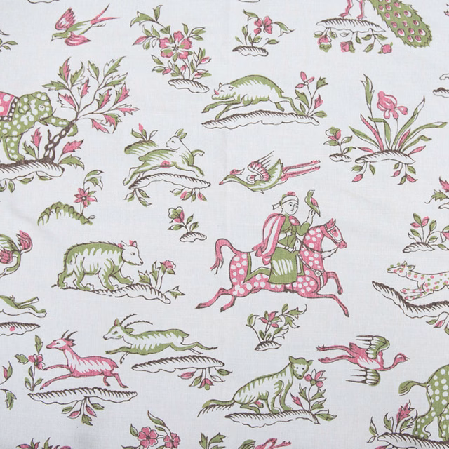 White printed fabric with pink and green safari animals and riders