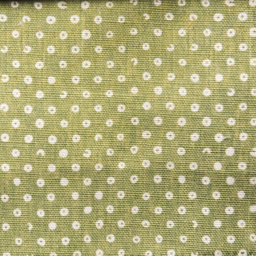 Linden green woven fabric with small white spot pattern