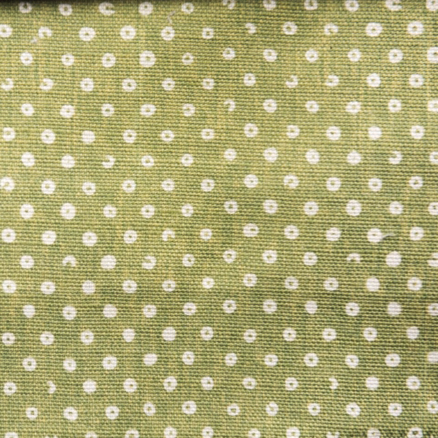 Linden green woven fabric with small white spot pattern