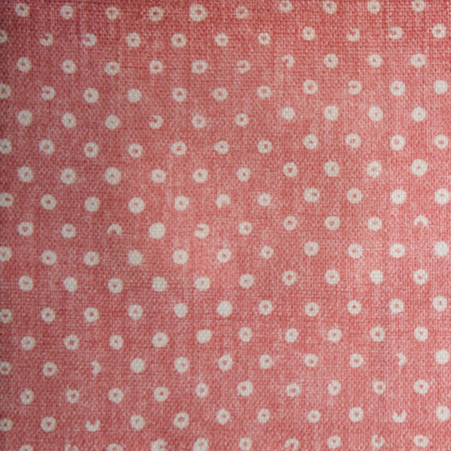 Rose pink small spot fabric with ivory dots and a textured weave