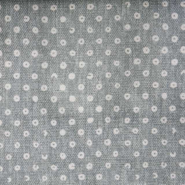 Soft sky-grey fabric with small cream-white dotted spot pattern