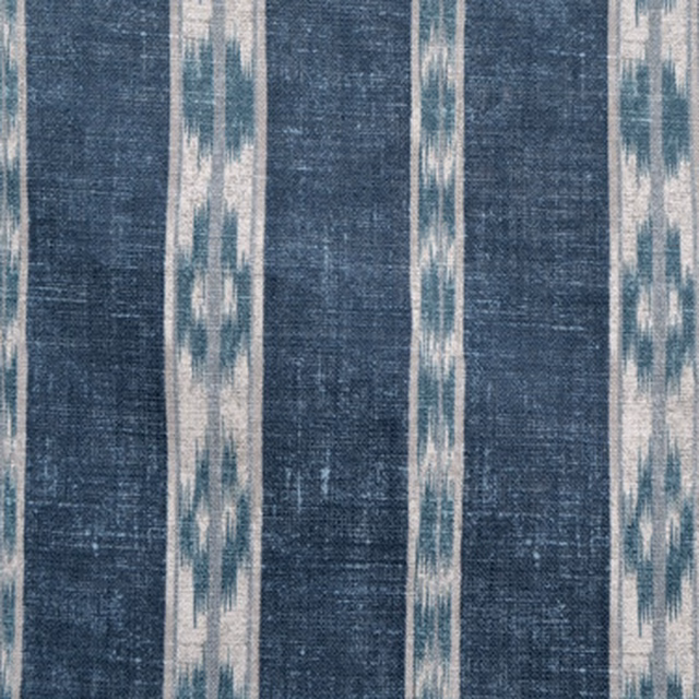 Blue indigo ikat stripe fabric with blurred ivory and teal vertical bands