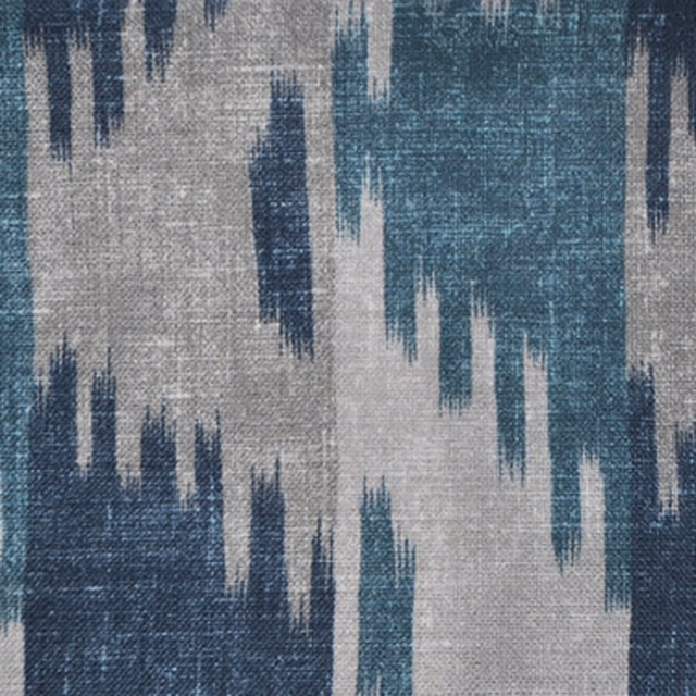 Abstract indigo and sapphire ikat pattern on a pale textured ground
