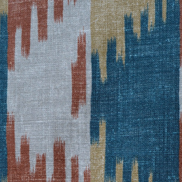Close-up of an ikat weave in turquoise, terracotta, cream and ochre