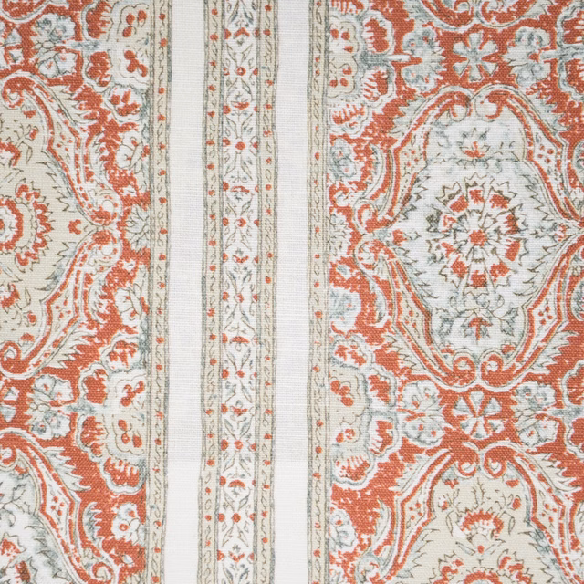 Terracotta and sage ornamental stripe fabric on an ivory ground