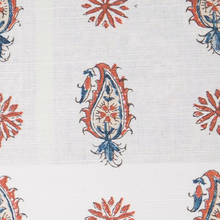 Cream fabric swatch with indigo and madder paisley motifs and small floral bursts