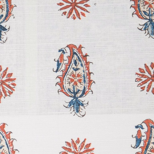 Cream fabric swatch with indigo and madder paisley motifs and small floral bursts