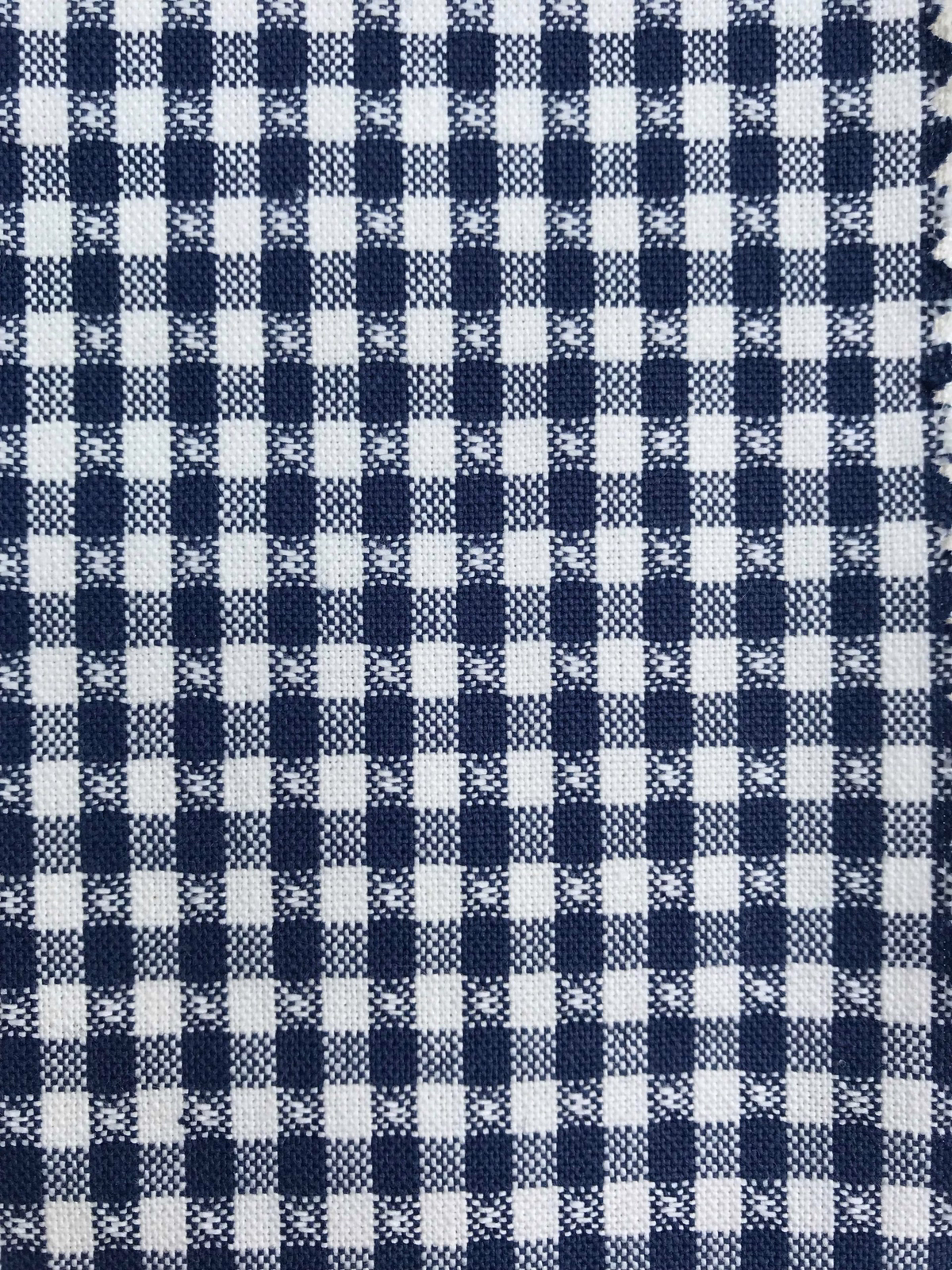Small navy and white checked woven fabric with a textured, nubby surface