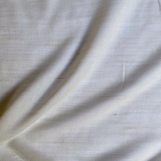 Pale cool grey sheer fabric with fine horizontal texture and soft folds