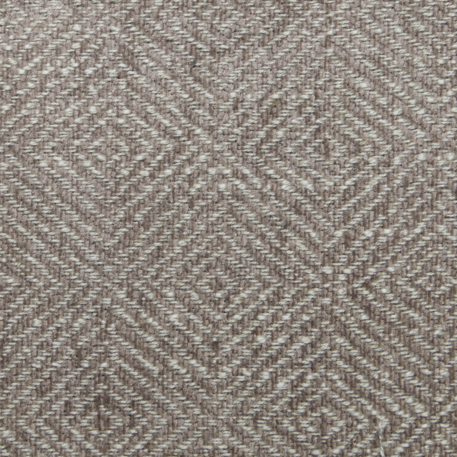 Close-up of a rose-beige geometric woven fabric with diamond motifs
