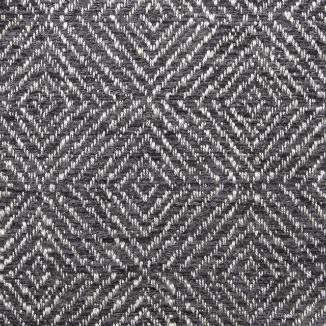 Close-up of slate grey geometric woven fabric with diamond and chevron pattern