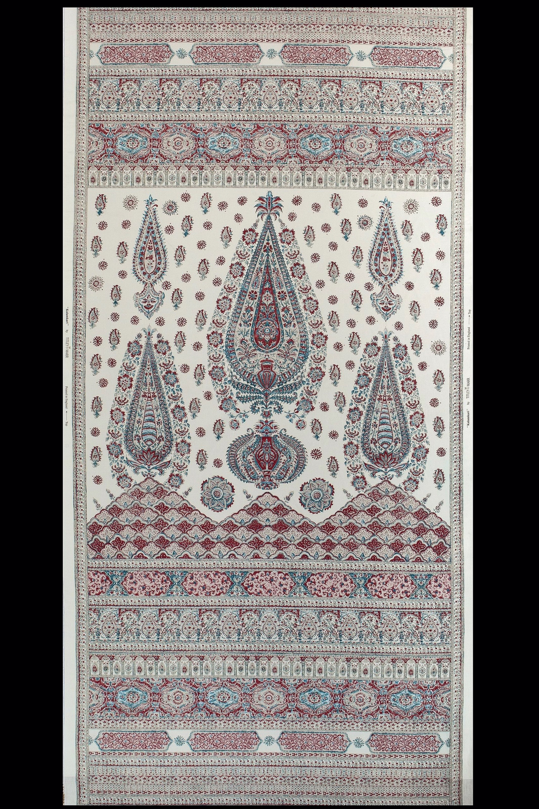 Cream kalamkari fabric with teal and red paisley motifs and border bands