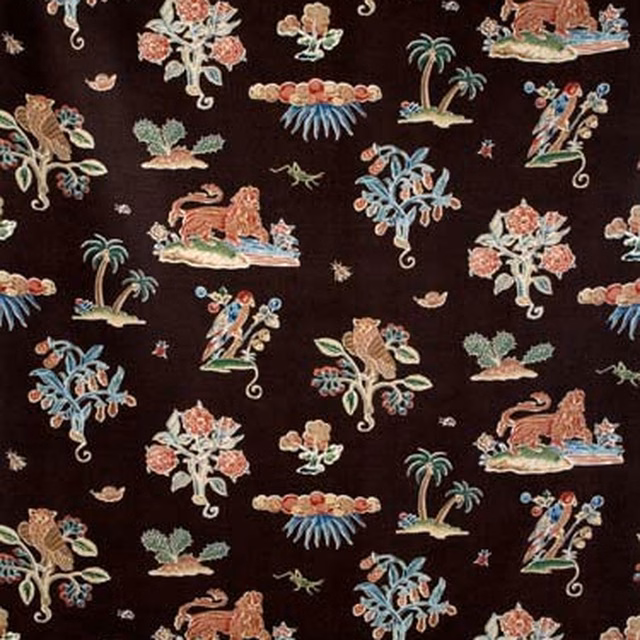 Dark brown fabric swatch with small multicoloured embroidered-style figures and palm motifs