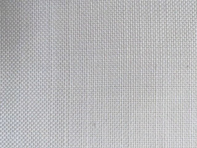 Close-up of soft off-white linen-look woven fabric with a fine textured surface