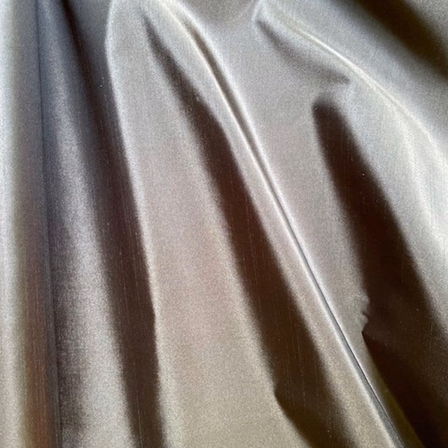 Pale pearl-grey taffeta with a glossy, softly folded surface