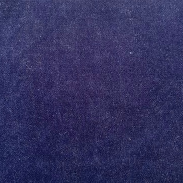 Close-up of deep indigo velvet with a soft, plush nap