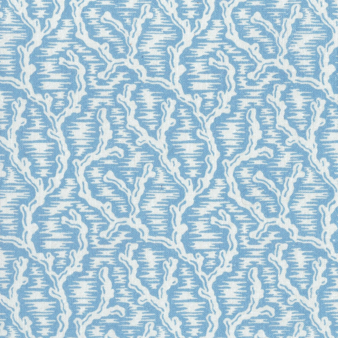 Soft blue printed fabric with an irregular ivory branching motif