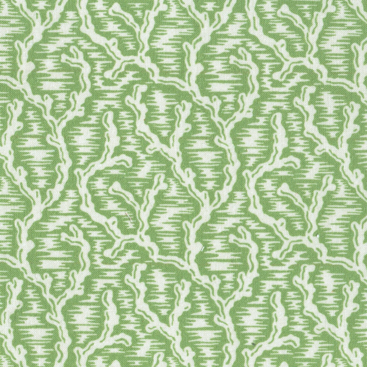 Green geometric fabric swatch with cream outlined lattice pattern