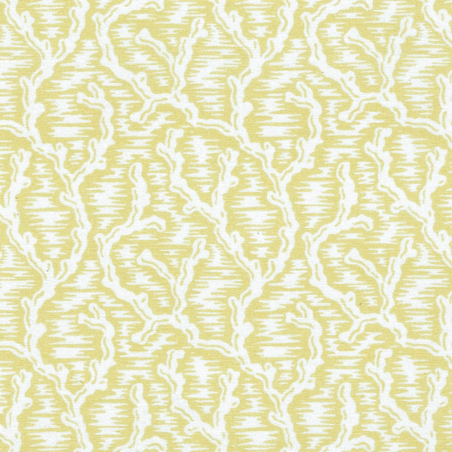Yellow and white textured woven fabric with a large scrolling pattern