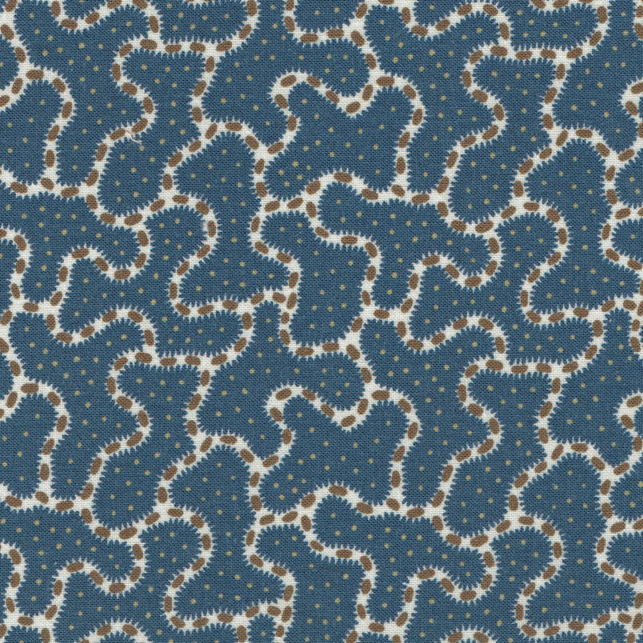 Blue patterned fabric with cream looping motif and tiny gold dots