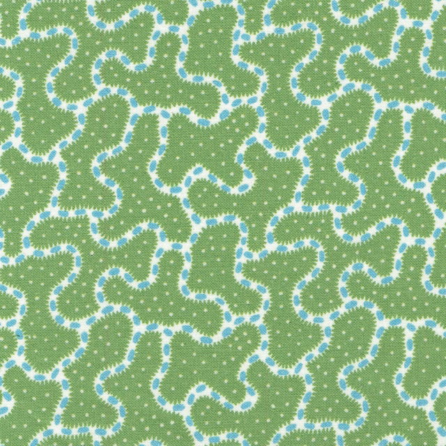 Large abstract green print with pale blue outlines and white dots on a woven ground