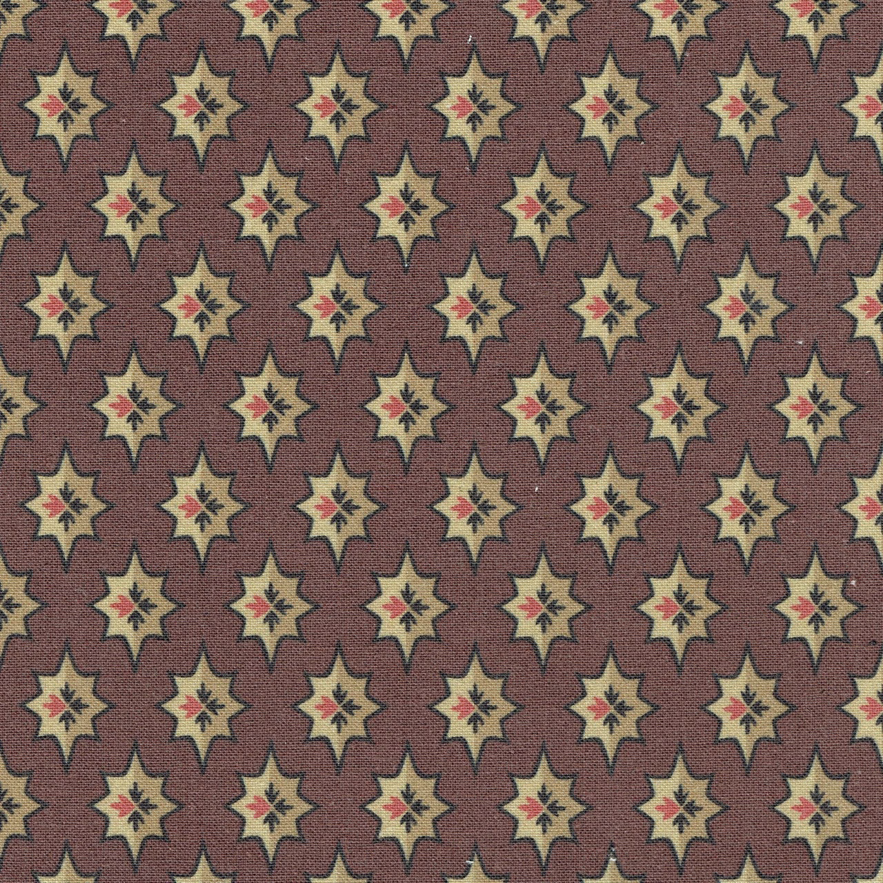 Dark red woven fabric with repeating cream star motifs and tiny red centres