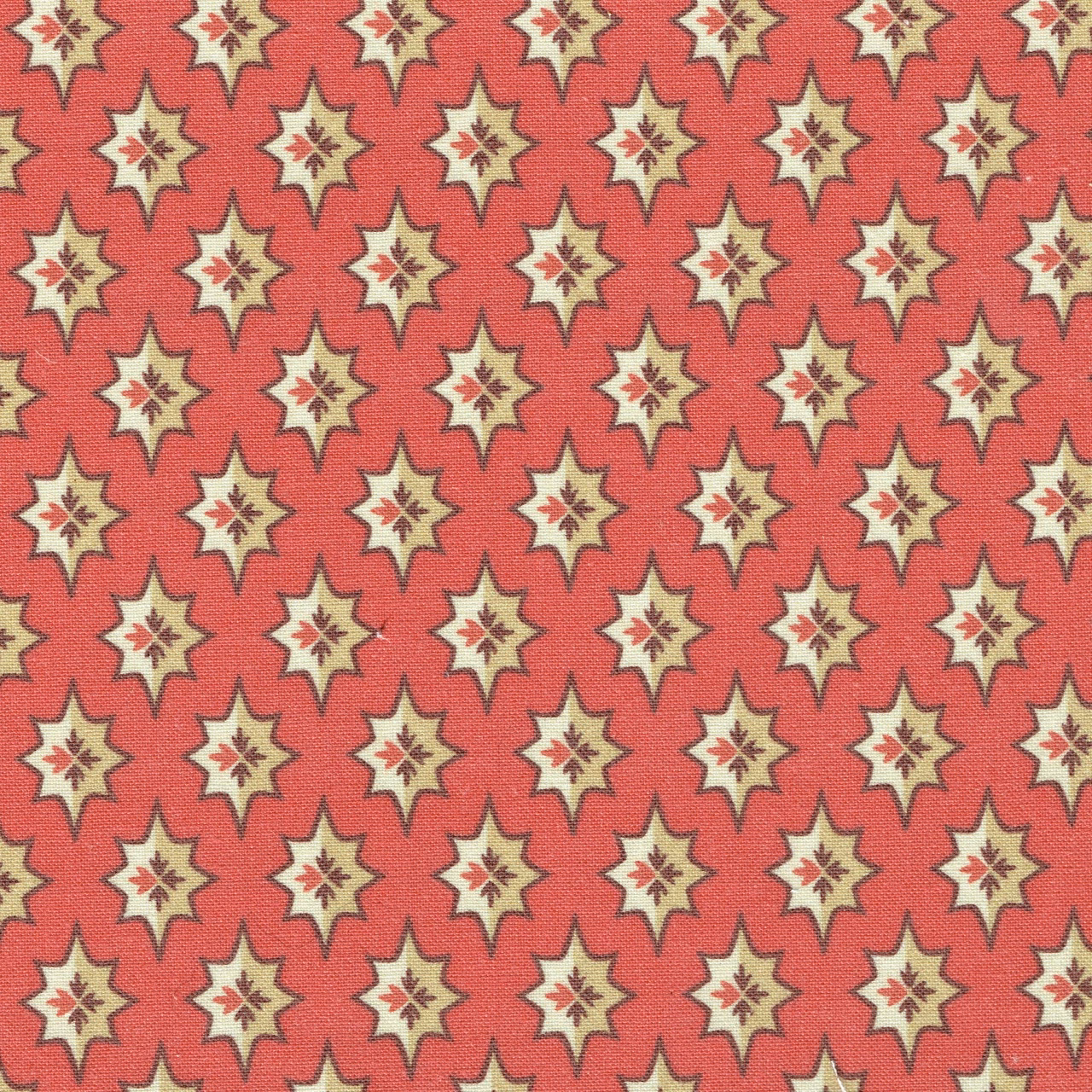Coral red fabric with small cream star motifs and berry details