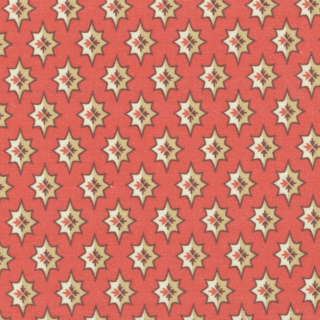Coral red fabric with small cream star motifs and berry details