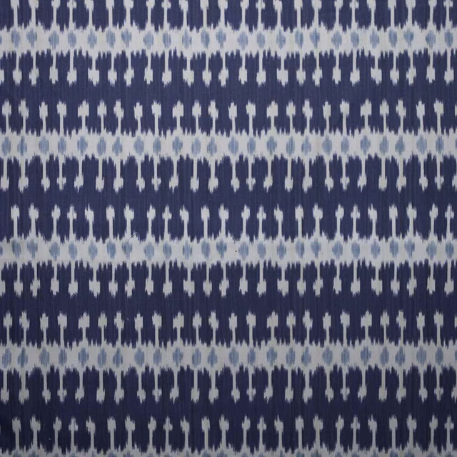 Close-up of navy and pale blue striped woven fabric with small vertical motif
