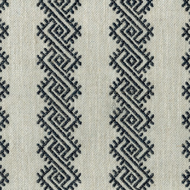 Pale woven fabric with repeating graphite diamond geometric embroidery