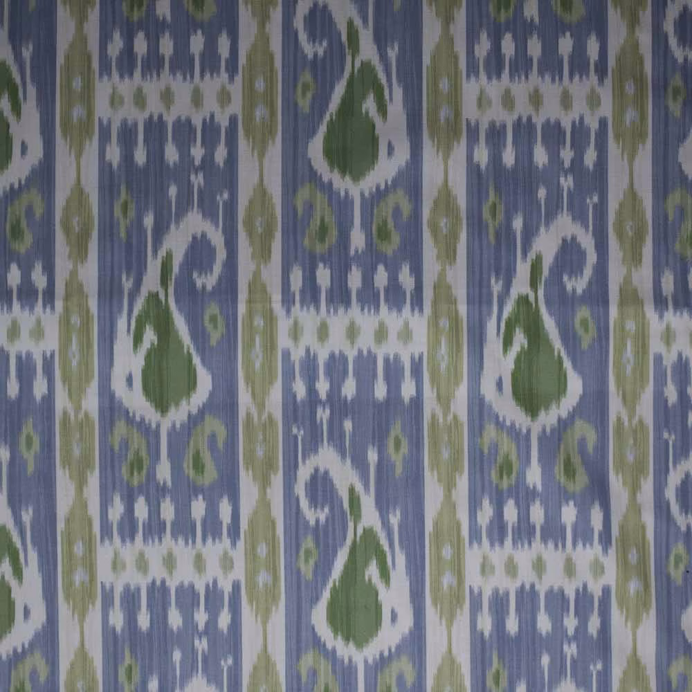Blue and olive green ikat fabric with white geometric motifs and vertical stripes