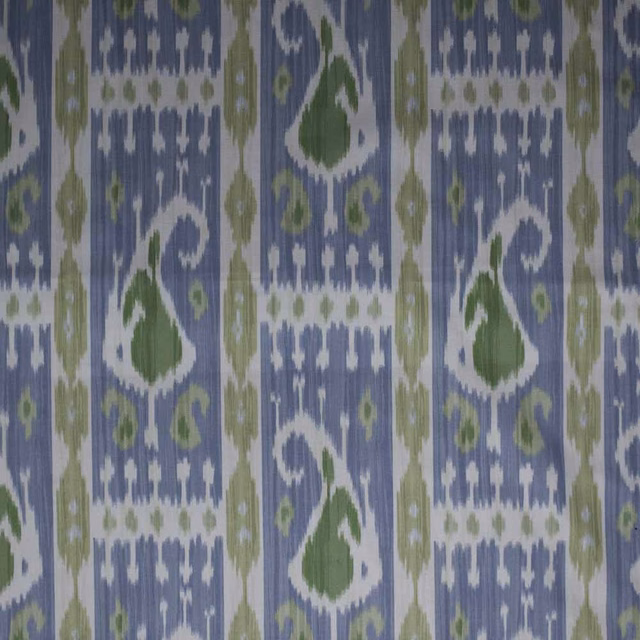 Blue and olive green ikat fabric with white geometric motifs and vertical stripes