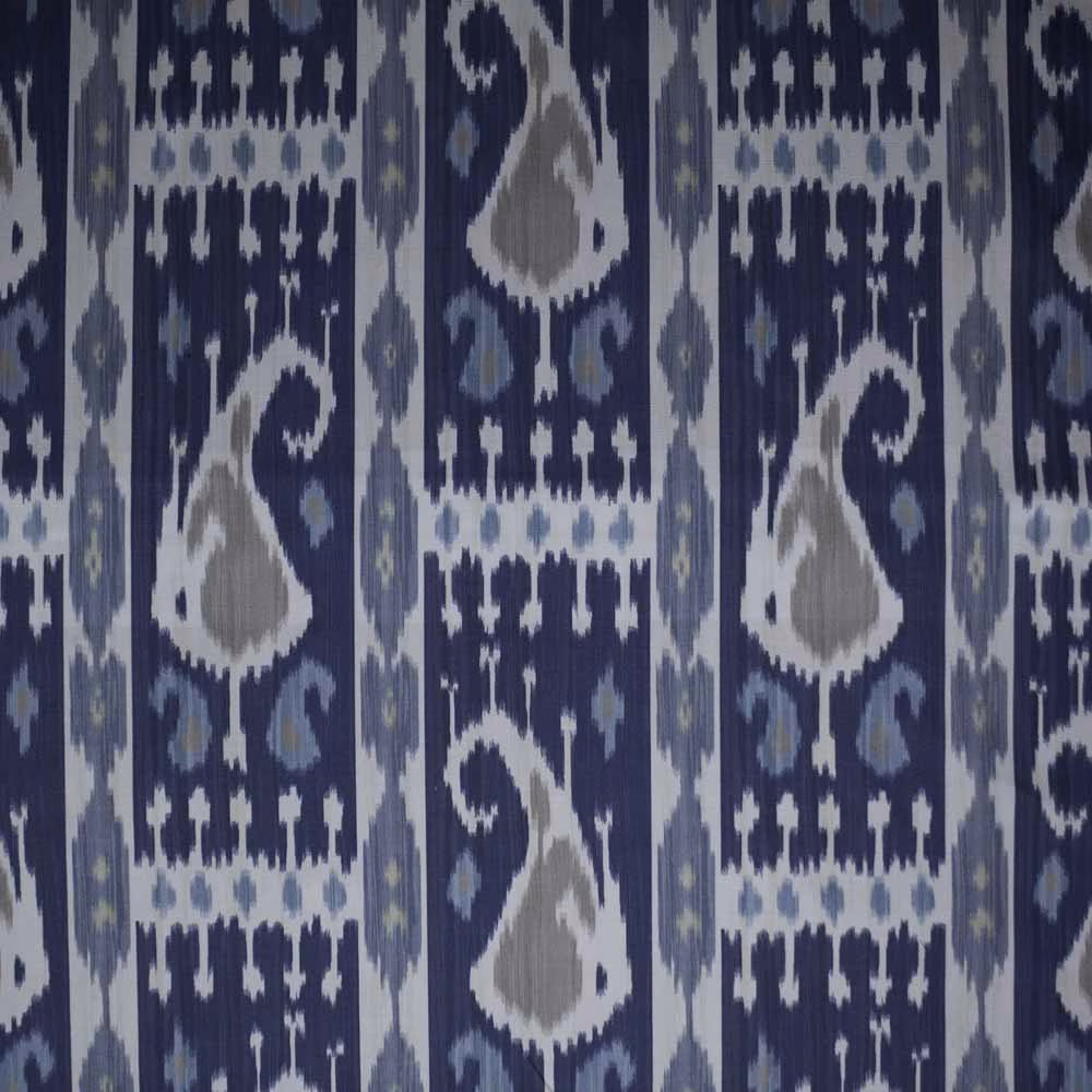 Navy ikat textile with pale blue, grey and white geometric motifs