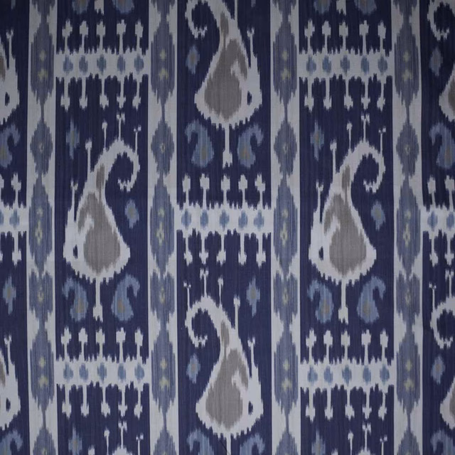Navy ikat textile with pale blue, grey and white geometric motifs