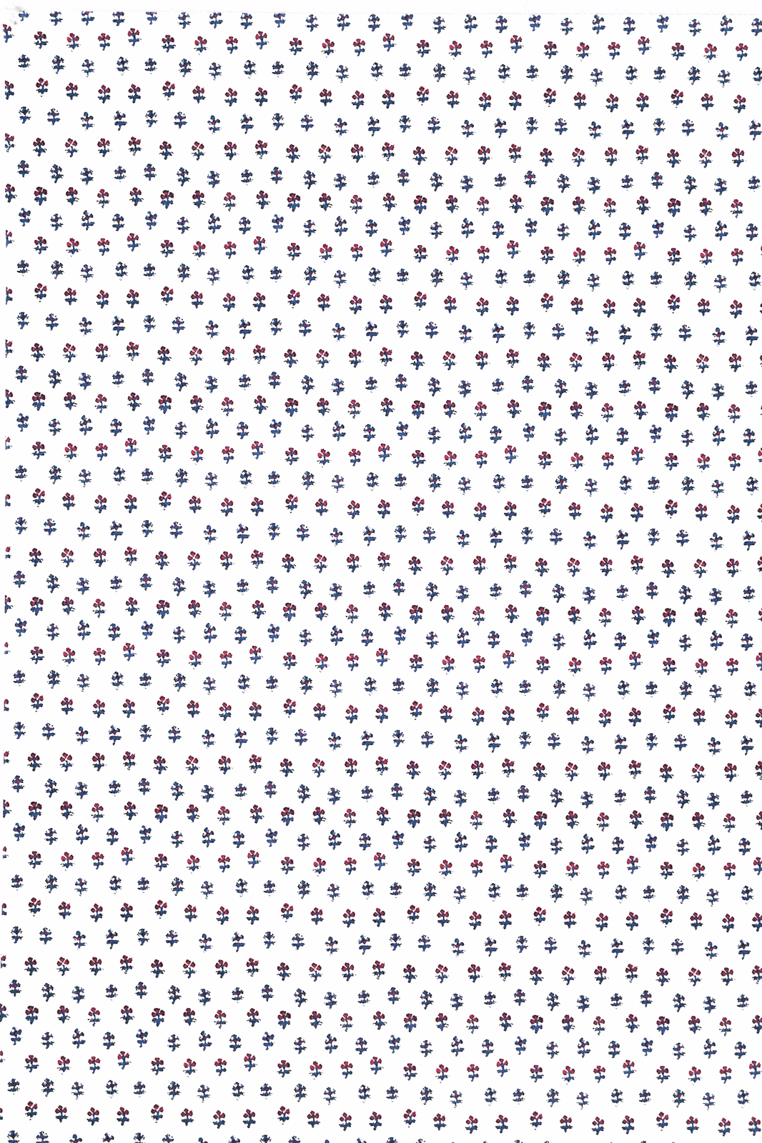 White fabric swatch with tiny navy and red sprig motif
