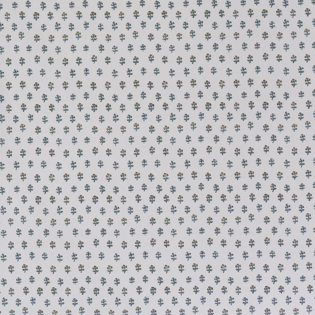 Pale fabric with tiny sage and blue-grey ditzy sprigs on a warm white ground