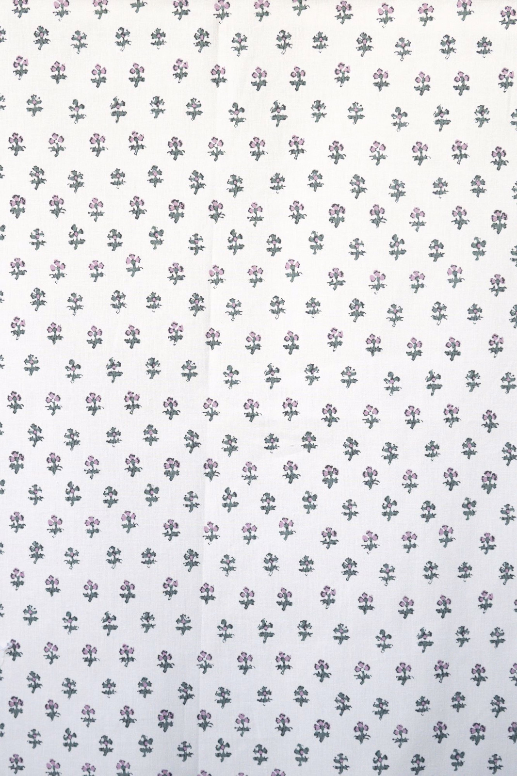 White fabric with tiny scattered pink and sage floral sprigs