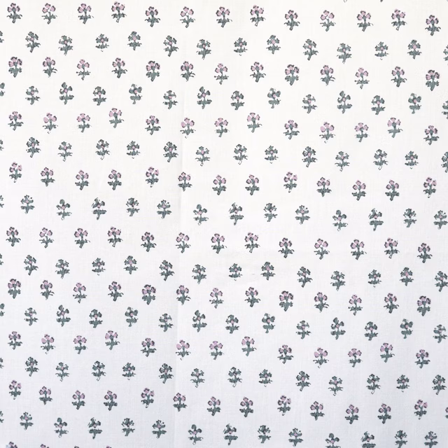 White fabric with tiny scattered pink and sage floral sprigs