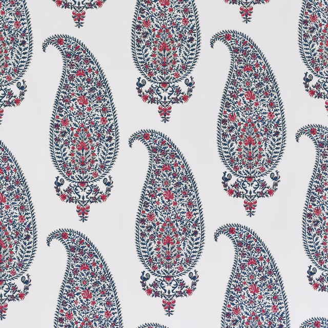 White fabric swatch with navy and red paisley teardrop motifs