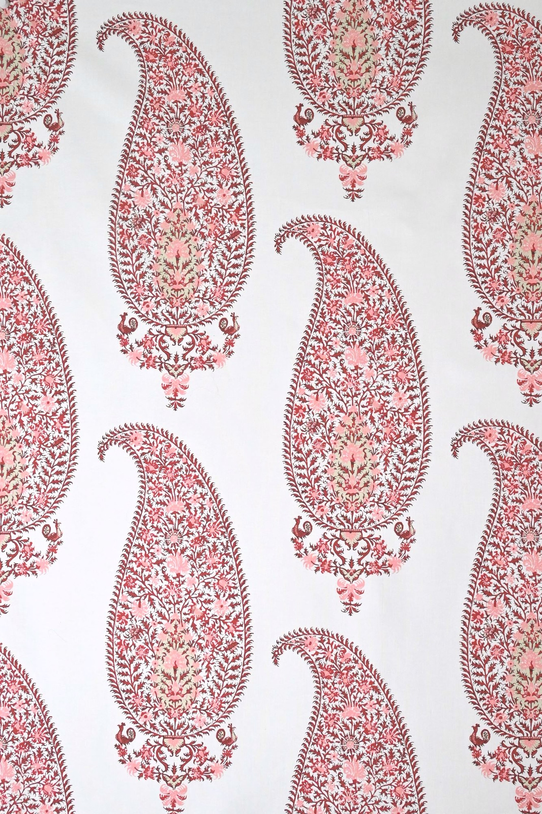 Large dusty rose paisley motifs on a pale cream ground