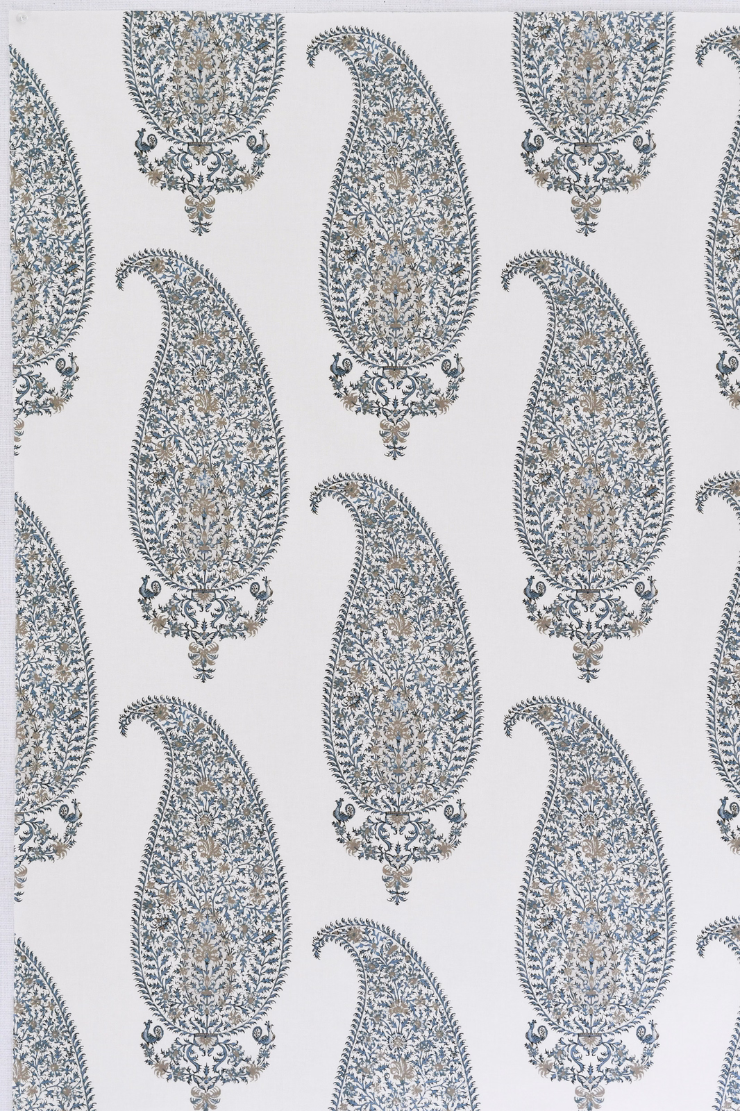 Large paisley print in soft dove grey, blue-grey and muted gold on a pale ground