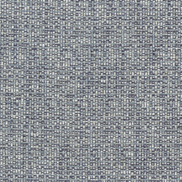 Close-up of a muted denim blue textured woven fabric with tiny flecks of grey and cream