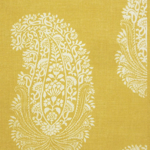 Mustard yellow printed fabric with large ivory paisley medallions