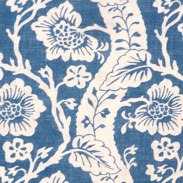 Denim blue fabric with ivory floral vine print on textured weave