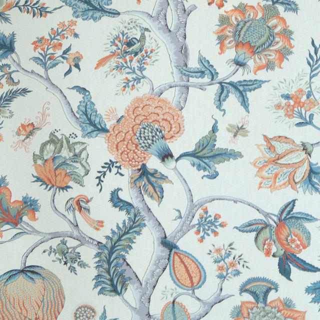 Printed fabric with pale branches, teal leaves, and amber floral motifs on an ivory ground