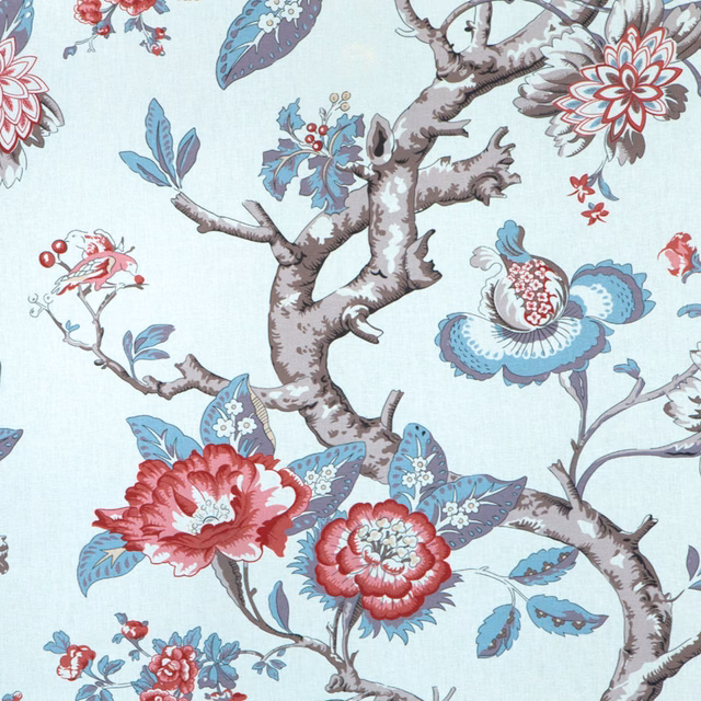 Pale blue botanical print fabric with red flowers and taupe branches