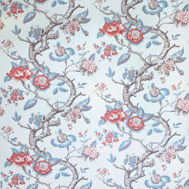 Pale blue botanical fabric with twisting branches, red flowers and blue leaves