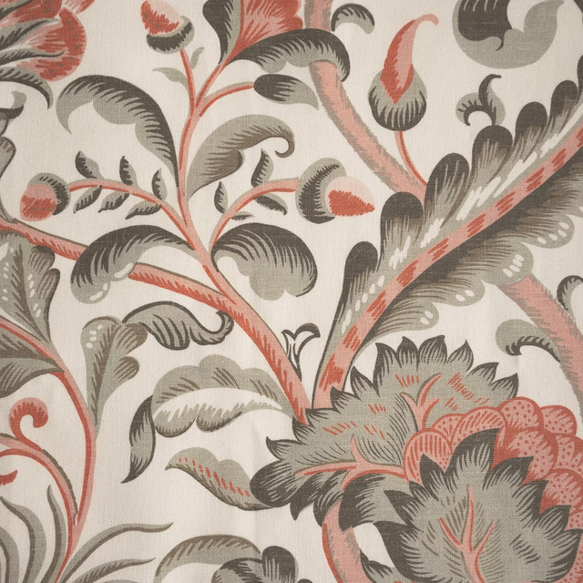 Large coral and grey floral scroll fabric on a pale ivory ground